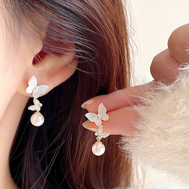 Silver trendy earrings in the shape of a butterfly